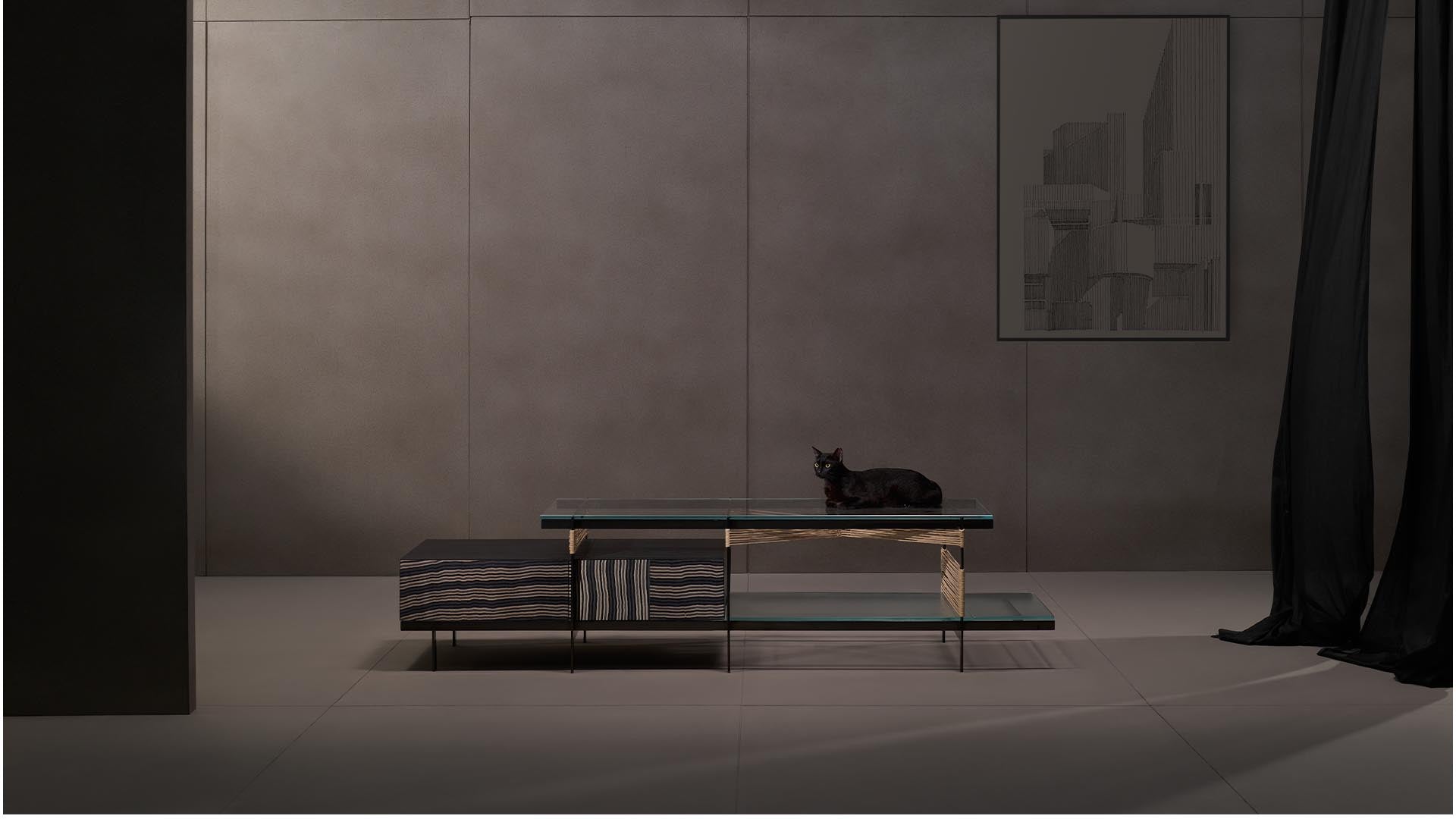 Kairos media console from Magari's IVAI Collection in a luxurious living room, featuring layered glass shelves, push-to-open drawers, and sophisticated styling.